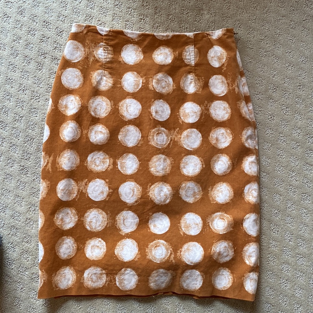 Like new! Skirt with white circle design. Size 12. Measurements in description.